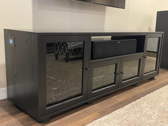 A B&A solid wood media console in a customer's home