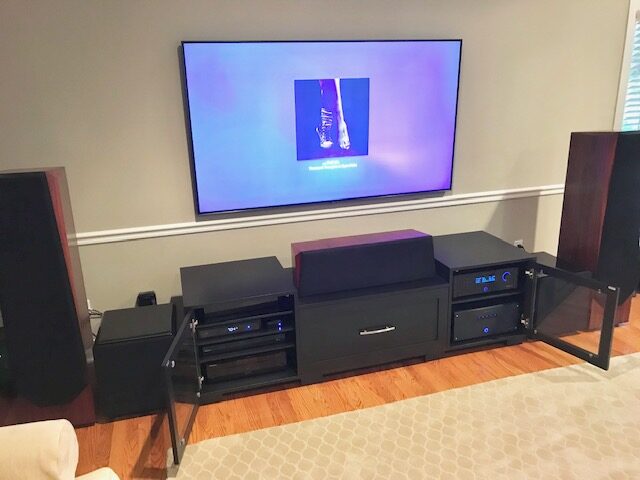 A B&A solid wood media console in a customer's home