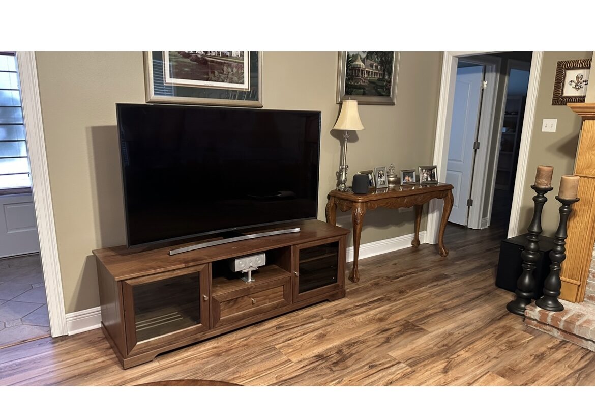 A B&A solid wood media console in a customer's home