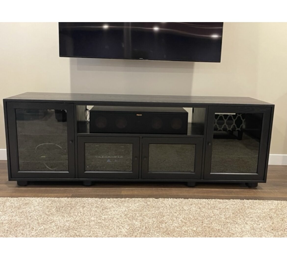 A B&A solid wood media console in a customer's home