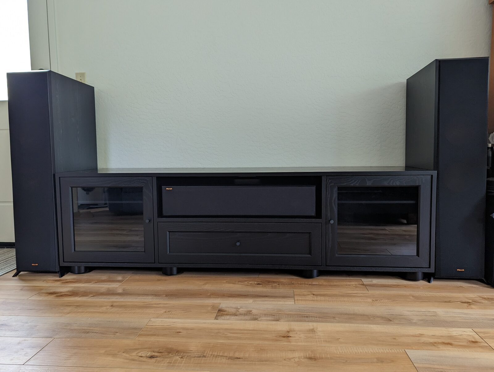 A B&A solid wood media console in a customer's home